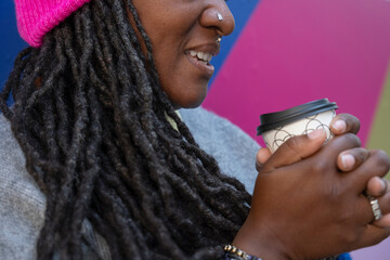 Close up of beautiful woman holding coffee cup