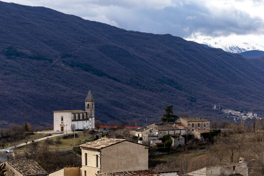 Beffi, Italy A small church in the village set in a mountainous landscape.
