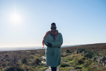 Portrait of senior woman hiking in moorland