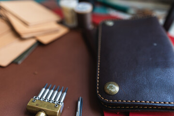 Genuine Italy vegetable tanned leather working leather wallet brass on leather background