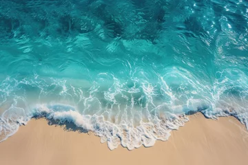 Fototapeten The calm of ocean waves on a deserted beach, turquoise sea and untouched sands aerial view of a peaceful, deserted beach with calm ocean waves gently breaking against sandy shores © khwanrudi