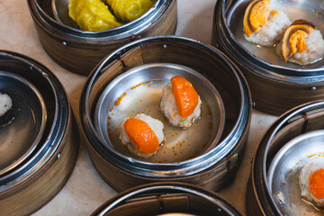 Close up of variation of dim sum in a restaurant, asian dishes
