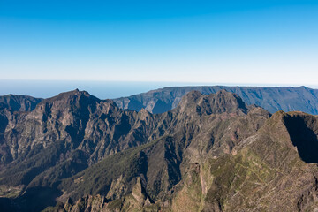 Scenic view of mountain ridges and majestic canyon of rugged terrain on Madeira island, Portugal,...
