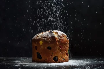 Foto op Aluminium easter bread christmas panettone glass sugar falls dusted on the panettone on a dark background © ERiK