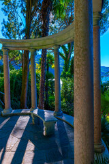 Patio with Column in the Forest on the Mountain Side and Blue Clear Sky in Park Scherrer in Morcote, Ticino, switzerland.