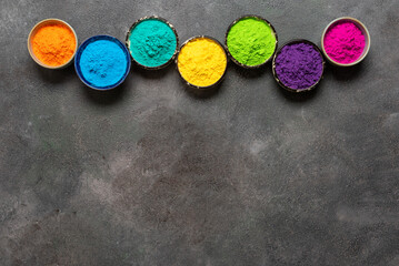 Border of colorful holi powders on dark grunge background. Top view, flat lay. - 747325447