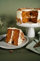 Homemade Carrot cake with cream cheese frosting topped with pecans
