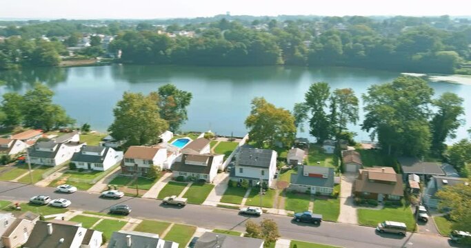 Small town in New Jersey with residential complex of single family homes is located near pond