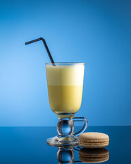 milk smoothie cocktail on blue background