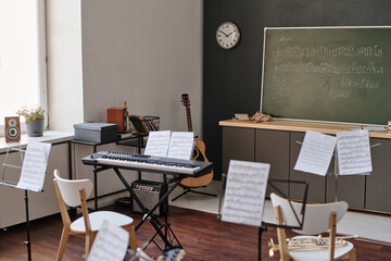 No people interior shot of classroom equipped with stands and instruments for music classes at...