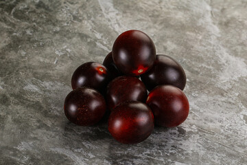 Raw ripe black kumato tomato