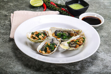 Open half oysters with green onion