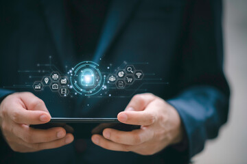 Cybersecurity and privacy concepts to protect data. Lock icon and internet network security technology. Businessman protecting personal data on smart phone with virtual screen interfaces.