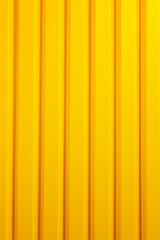 Abstract vertical metallic yellow background with lines