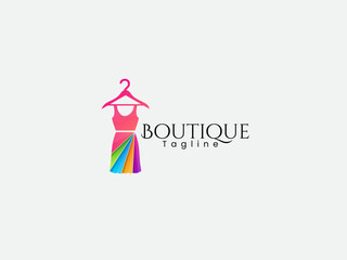Colorful Boutique logo. Multicolor Female dress vector art. Pink gradient. Fashion dress logo design. Clothing business. Female dress art. Beauty.