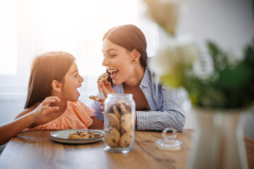 Kitchen delights -Mother and daughter enjoying cookies together