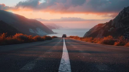 Foto op Canvas A truck driving down a road next to the ocean © Maria Starus