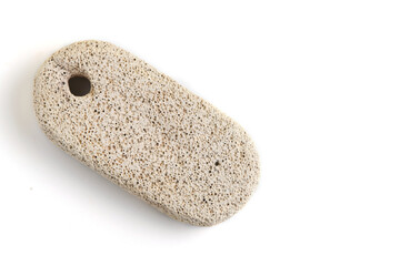 Pumice stone for cleaning feet and heels, on white background.