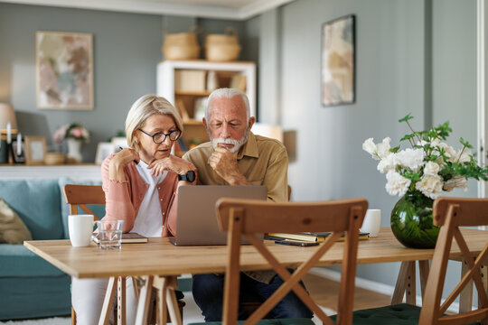 Senior couple working together from home