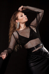 Fashion portrait of young beautiful woman with jewelry. Blond girl.