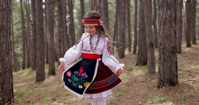 Bulgarian woman young girl in ethnic folklore embroidery costume Bulgaria