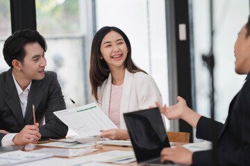 Young smart business colleagues collaborating and gathering news idea together in the meeting room.