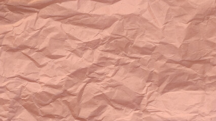 Craft crumpled paper, cardboard background. Brown kraft sheet texture, torn antique page, wallpaper or parchment abstract design