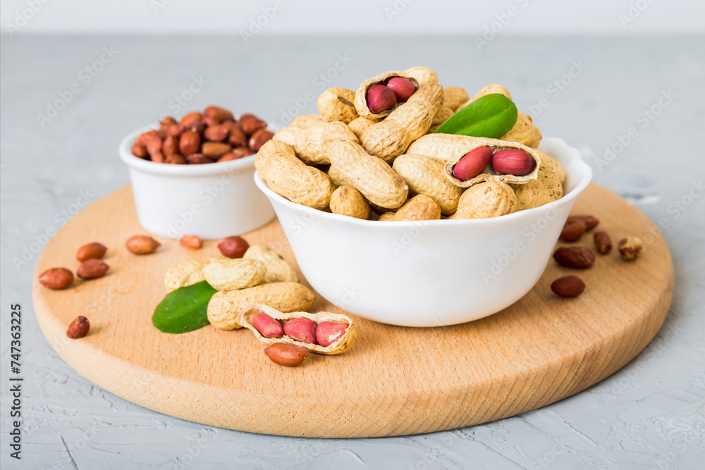 Wall mural Fresh healthy peanuts in bowl on colored table background. Top view Healthy eating bertholletia concept. Super foods - Wall murals