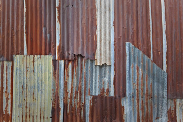 Grunge rusty zinc or rust iron barn wall for texture background