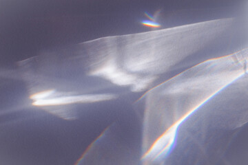 Sunlight background, abstract backdrop with light and shadow, glare and shine on paper texture, rainbow sun flare, blue violet color aesthetic image. Natural beams light, caustics effect