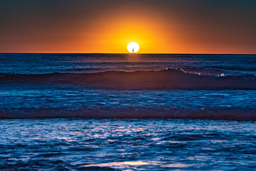 California sunset with sailboat.