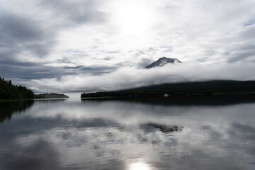 A foggy morning on Lake Clark in Alaska. Port Alsworth and Hardenburg Bay in Lake Clark National Park and Preserve. Inverted cloud layer, inversion layer, low visibility.