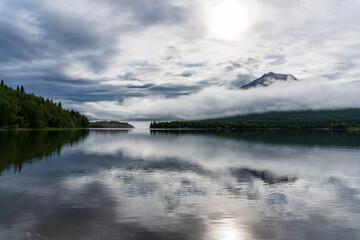 A foggy morning on Lake Clark in Alaska. Port Alsworth and Hardenburg Bay in Lake Clark National Park and Preserve. Inverted cloud layer, inversion layer, low visibility.