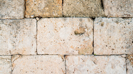 close-up of the stone wall of the ancient Greek temple in the city of Perga in Turkey