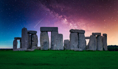 Landscape image of Milky way galaxy at night sky with stars over Stonehenge an ancient prehistoric...