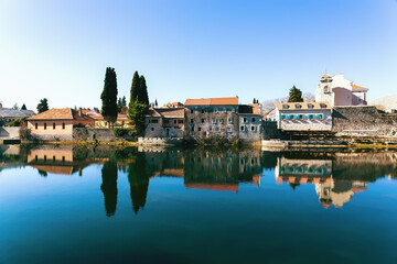 Trebinje Old Town, Bosnia and Herzegovina. View of old town with reflection in river in calm sunny day