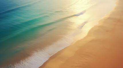 Beautiful turquoise ocean and empty sand beach. Sunlight reflecting in warm water with white waves rolling over the shore. Tropical landscape. Top view, from above.