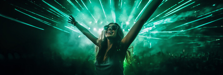 Party girl dance in techno club spotlight. Happy woman with hands up raving in night club laser lights show. Trance music with green neon background