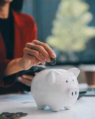 Businesswoman save money in piggy bank and goal and achievement chart graph and arrows. Funds loans...