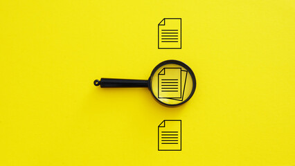 Audit and verification of documentation. Bureaucracy. Authenticity check. List of required documents. Archive. Picture of documents under the magnifying glass - Powered by Adobe