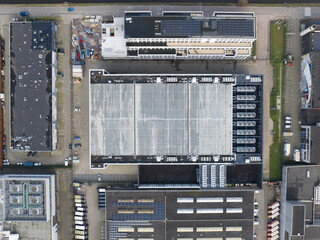 Aerial top down drone view on a data center and cooling vans build in the roof.