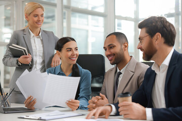 Lawyers working together at table in office