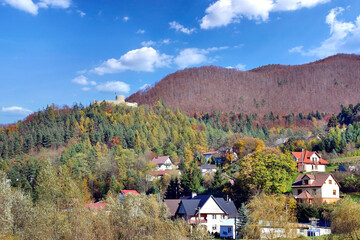 Autumn scenery in the mountains. Castle on the hill among the colorful forests, Rytro, Poland.