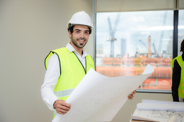 Professional male caucasian engineer or manufacturing worker man person in factory portrait, smart industry business manager occupation job with safety helmet for construction work, machinery foreman