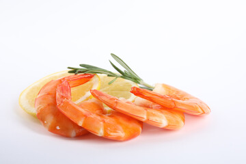 Delicious cooked shrimps, lemon and rosemary isolated on white