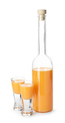 Bottle and shot glasses with tasty tangerine liqueur isolated on white