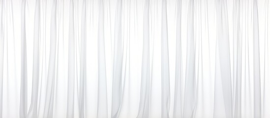 Obraz premium A white curtain is elegantly displayed against a plain white background. The fabric appears crisp and clean, creating a simple yet stylish visual impact.