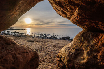 Cave's Embrace: Sunset Glow in Veczemju Klintis