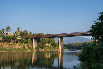 The Nam Khan River, which flows into the Mekong River, is located in Luang Prabang, Laos, Asia.
