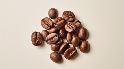 A close-up photo of freshly roasted coffee beans against a white backdrop, showcasing their texture and color. Perfect for coffee-related content and social media posts. - obrazy, fototapety, plakaty